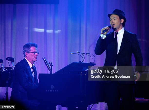 Music producer/musician David Foster and Victor Micallef of The Canadian Tenors perform onstage during Celebrity Fight Night XVI on March 20, 2010 at...