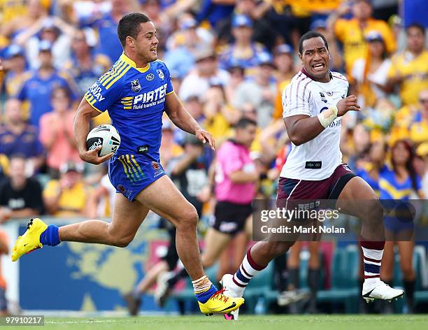 Jarryd Hayne of the Eels makes a line break as Tony Williams of the Eagles gives chase during the round two NRL match between the Parramatta Eels and...