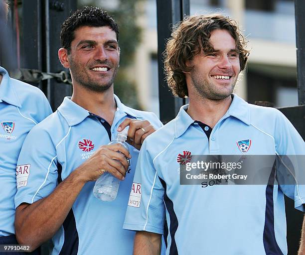 John Aloisi and Karol Kisel of Sydney FC look out to the crowd during the Sydney FC A-League Grand Final celebrations at The Domain on March 21, 2010...