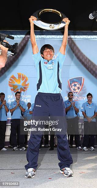 Sung-Hwan Byun of Sydney FC holds up the trophy during the Sydney FC A-League Grand Final celebrations at The Domain on March 21, 2010 in Sydney,...