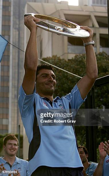 John Aloisi of Sydney FC holds up the trophy during the Sydney FC A-League Grand Final celebrations at The Domain on March 21, 2010 in Sydney,...