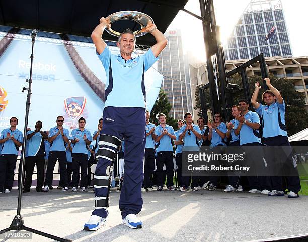 Steve Corica of Sydney FC holds up the trophy during the Sydney FC A-League Grand Final celebrations at The Domain on March 21, 2010 in Sydney,...