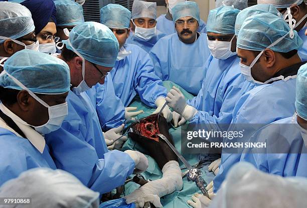 Prof. Ross Crawford from Australia performs a hip arthoplasty on a cadaver during a specialized course for joint replacement surgeons at the All...