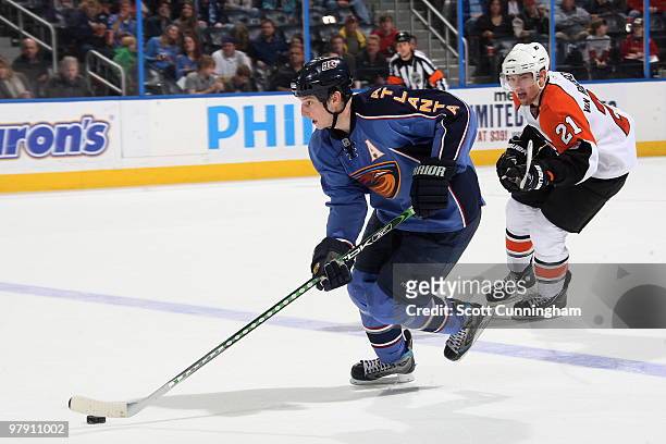 Colby Armstrong of the Atlanta Thrashers carries the puck against the Philadelphia Flyers at Philips Arena on March 20, 2010 in Atlanta, Georgia.