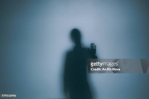 person touching window - mann einsam stock-fotos und bilder