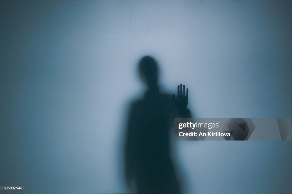 Person touching window