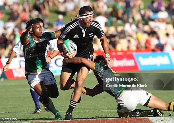 Zar Lawrence of New Zealand is tackled during day three of the IRB Adelaide International Rugby Sevens match between New Zealand and South Africa at...