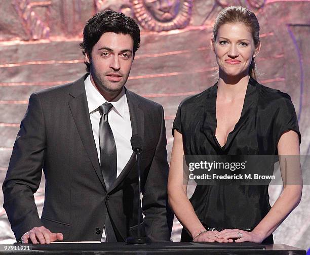 Actor Reid Scott and actress Tricia Helfer speak during the 24th Genesis Awards at the Beverly Hilton Hotel on March 20, 2010 in Beverly Hills,...