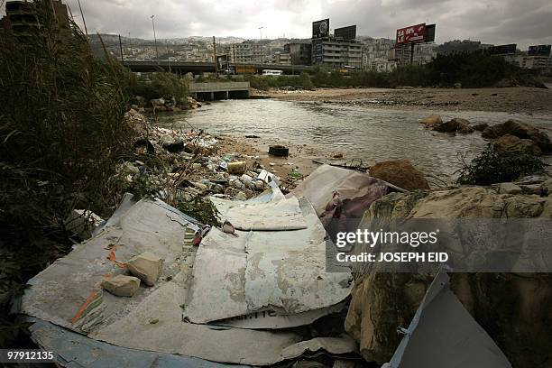 Garbage lies on the banks of a river flowing into the Mediterranean Sea in Dbayeh, north of the Lebanese capital Beirut, on March 16, 2010. Experts...