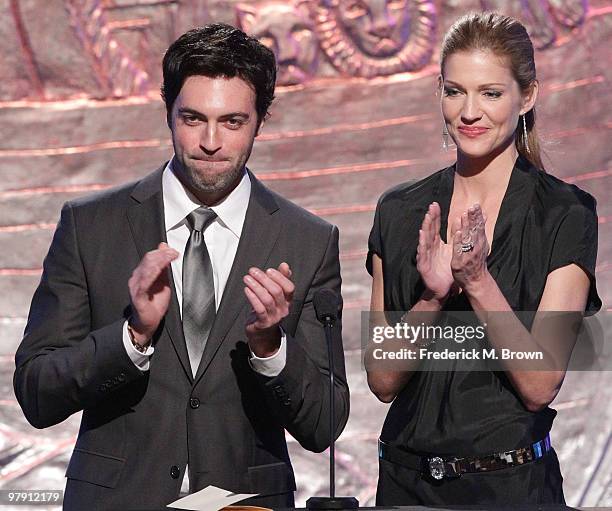 Actor Reid Scott and actress Tricia Helfer speak during the 24th Genesis Awards at the Beverly Hilton Hotel on March 20, 2010 in Beverly Hills,...