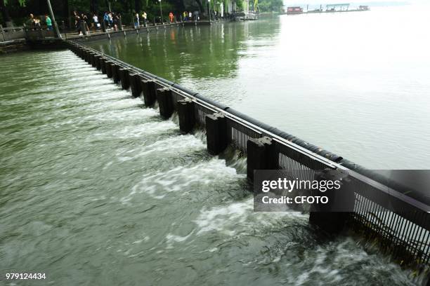 On June 20 the shengtang gate of west lake in hangzhou, zhejiang province, China, lowered the water level of west lake by releasing water from the...