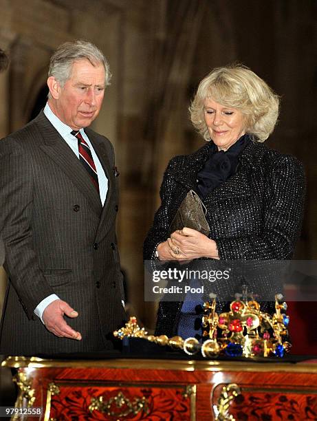 Prince Charles, Prince of Wales and Camilla, Duchess of Cornwall study the Crown Jewels of the Czech Republic as they tour Prague Castle on March 20,...