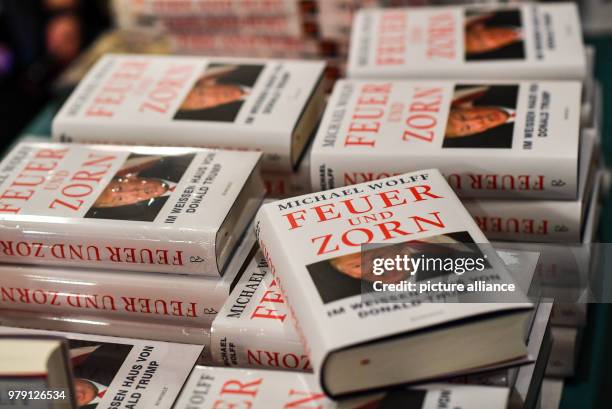 February 2018, Germany, Berlin: 'Fire and Fury' books by US-American author Michael Wolff during the book premire of 'Fire and Fury' at the...