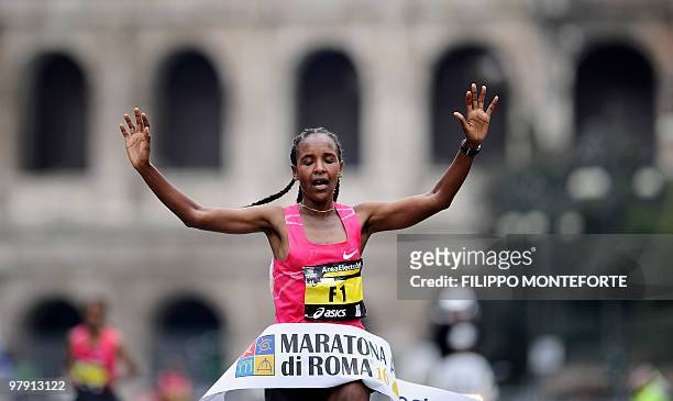 Ethiopian Firehiwot Dado Tufa crosses the finish line after winning the 16th Rome Marathon 'Maratona di Roma' on March 21, 2010. AFP PHOTO / Filippo...