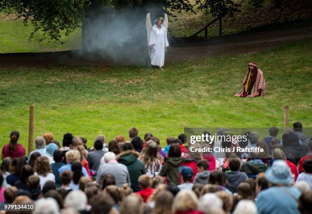 An actor depicting the Archangel Gabriel appears amongst smoke to speak to Joseph during the first act in a production of 'The Life of Christ' by the...