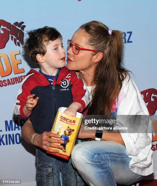 March 2018, Germany, Munich: Actress Doreen Dietel and her son Marlow arriving at the preimere of 'Fünf Freunde und das Tal der Dinosaurier' . The...