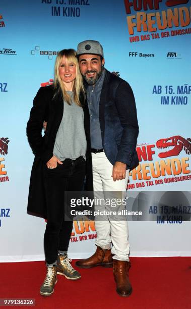 March 2018, Germany, Munich: Actor Adnan Maral and his wife Frau Franziska arriving at the premiere of 'Fünf Freunde und das Tal der Dinosaurier' ....