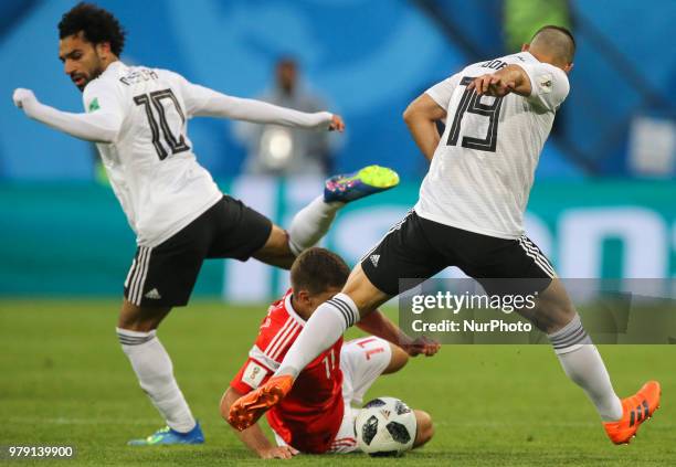 Mohamed Salah , Abdalla Said of the Egypt national football team vie for the ball during the 2018 FIFA World Cup match, first stage - Group A between...