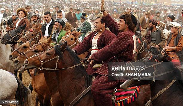 Afghan horsemen parade in front of officials before a game of Buzkashi in the northern city of Mazar-i-Sharif, the capital of the ancient Balkh...