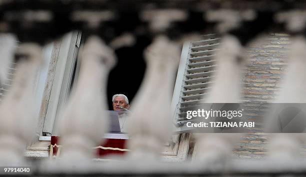 Pope Benedict XVI celebrates his Sunday Angelus prayer from the window of his apartment on St. Peter's square at the Vatican on March 21, 2010. AFP...
