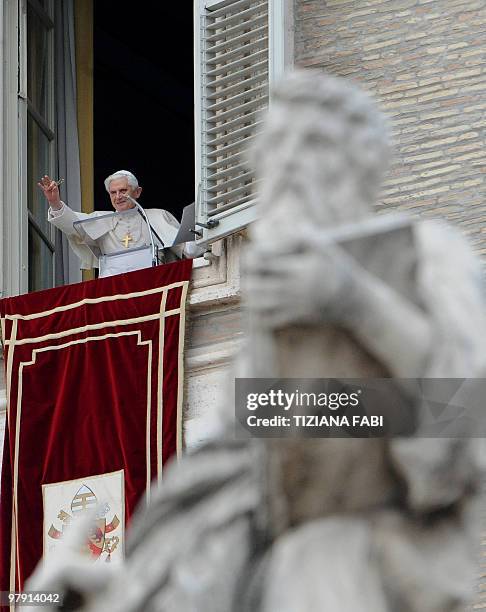 Pope Benedict XVI celebrates his Sunday Angelus prayer from the window of his apartment on St. Peter's square at the Vatican on March 21, 2010. AFP...