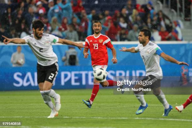 Alexander Samedov of the Russia national football team vie for the ball during the 2018 FIFA World Cup match, first stage - Group A between Russia...