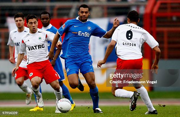 Mike Terranova and Daniel Gordon of Oberhausen in action with Marvin Matip of Karlsruhe during the Second Bundesliga match between RW Oberhausen and...