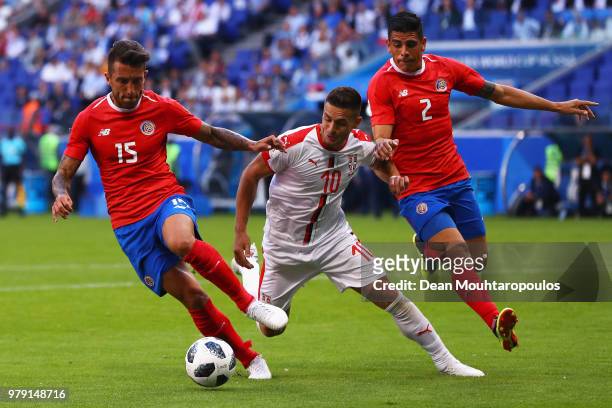 Dusan Tadic of Serbia is challenged by Francisco Calvo of Costa Rica and Johnny Acosta of Costa Rica during the 2018 FIFA World Cup Russia group E...