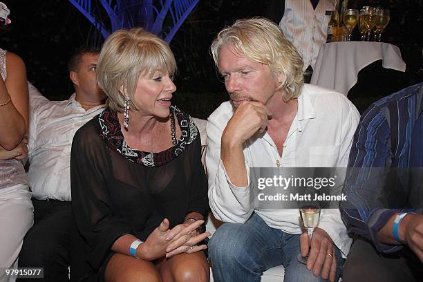 Richard Branson speaks with Rhonda Wyllie during the 'Branson By The Pool' function, as part of a series of fundraising events for the Strike A Chord...