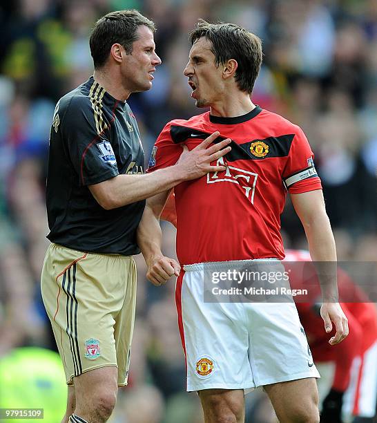 Jamie Carragher of Liverpool argues with Gary Neville of Manchester United after United were awarded a penalty in the first half of the Barclays...