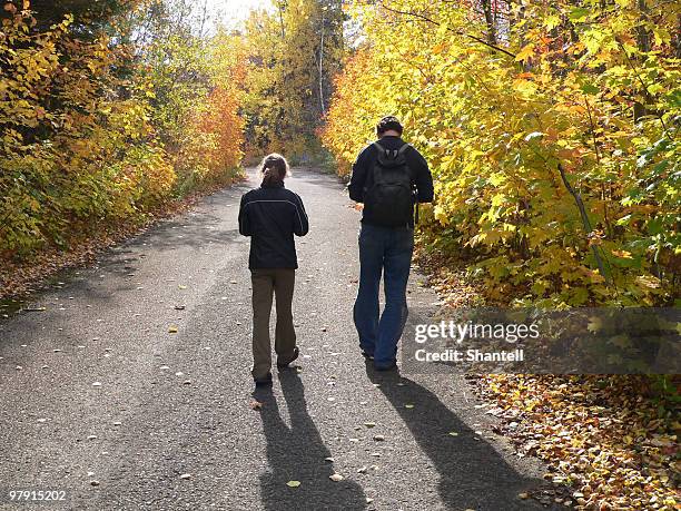 father and daughter walking in woods - geocaching stock pictures, royalty-free photos & images