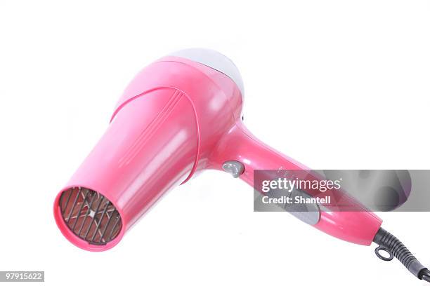 pink hairdryer - haardroger stockfoto's en -beelden