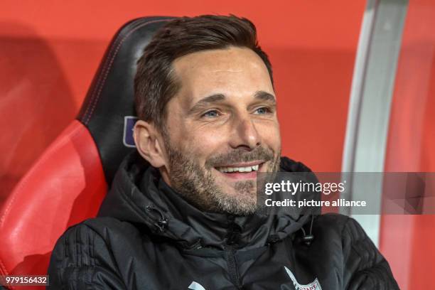 March 2018, Germany, Ingolstadt, Soccer, Second Bundesliga, FC Ingolstadt 04 vs. VfL Bochum at Audi sports park: Ingolstadt's coach Stefan Leitl sits...