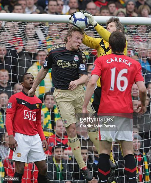 Edwin van der Sar of Manchester United clashes with Dirk Kuyt of Liverpool during the FA Barclays Premier League match between Manchester United and...
