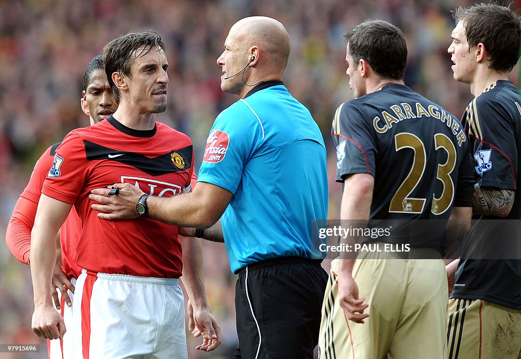 Referee Howard Webb holds Manchester Uni