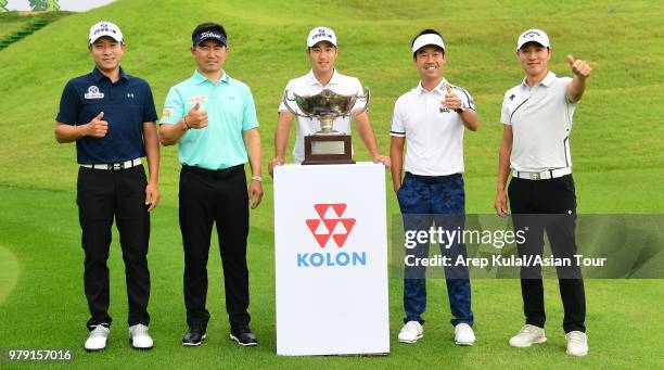 Kim of Korea, Y.E. Yang of Korea. Yikuen Chang of Korea, Kevin Na of USA and Bae Sangmoon of Korea pose with the trophy during photo call ahead of...