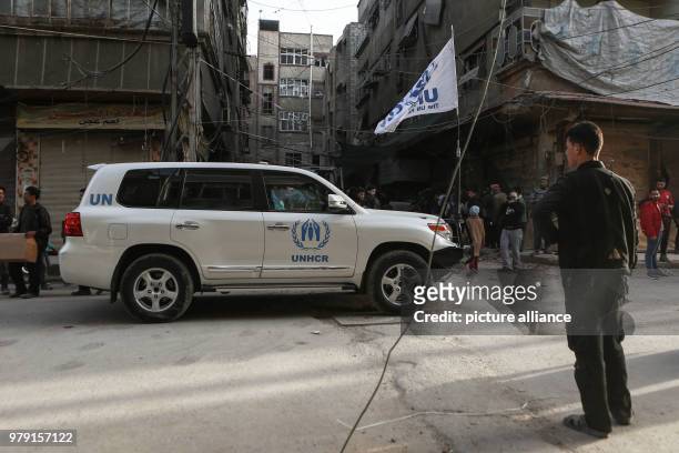 Dpatop - An aid convoy of UN Agencies drives through the rebel-held city of Douma, Eastern Ghouta province, Syria, 05 March 2018. The 46-truck convoy...