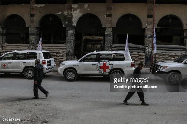 An aid convoy of the International Committee for the Red Cross drives through the rebel-held city of Douma, Eastern Ghouta province, Syria, 05 March...