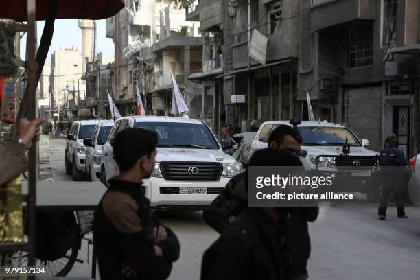 An aid convoy of the International Committee for the Red Cross drives through the rebel-held city of Douma, Eastern Ghouta province, Syria, 05 March...