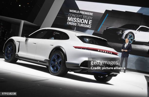 Oliver Blume, chairman of the board of Porsche, presenting Porsche's Mission E Cross Turismo during the first press day of the Geneva Motor Show in...