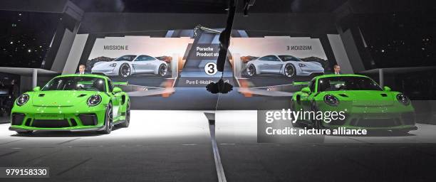 The Porsche 911 GT3 RS being presented, and reflected by a glass on the right side of the picture, during the first press day of the Geneva Motor...