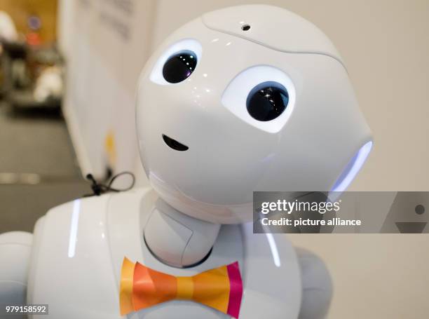 The robot Pepper during the fair Elderly Care 2018 in Hannover, Germany, 06 March 2018. He is 1.20 meters tall, counts with round eyes and friendly...