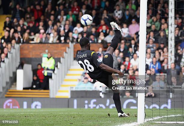 Kolo Toure of Manchester City clears the ball off the line during the Barclays Premier League match between Fulham and Manchester City at Craven...