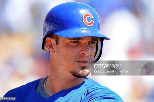 Ryan Theriot of the Chicago Cubs waits on deck during a spring training game against the Chicago White Sox on March 19, 2010 at The Ballpark at...