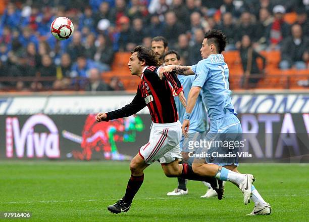 Andrea Pirlo of AC Milan competes for the ball with Marek Hamsik of SSC Napoli during the Serie A match between AC Milan and SSC Napoli at Stadio...