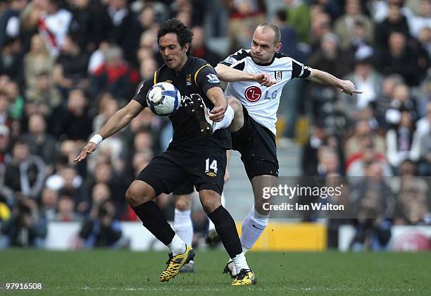 Roque Santa Cruz of Manchester City and Danny Murphy of Fulham battle for the ball during the Barclays Premier League match between Fulham and...