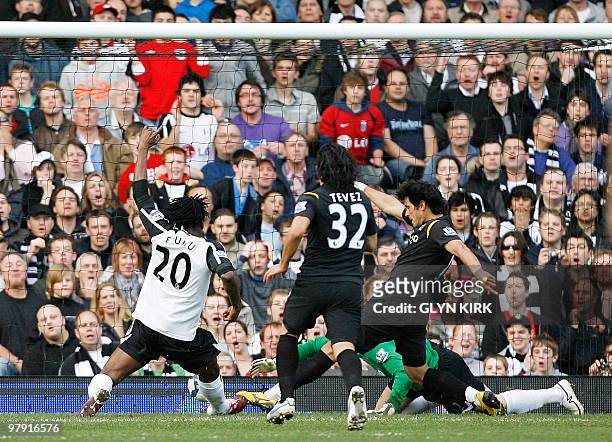 Manchester City's Paraguayan striker Roque Santa Cruz scores against Fulham during their English Premier League football match at Craven Cottage,...