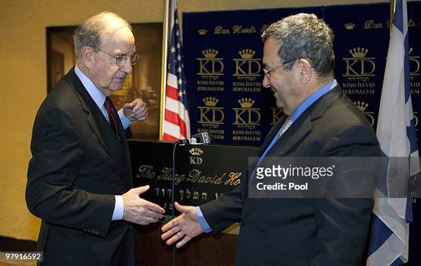 Israeli Defence Minister Ehud Barak greets US Middle East envoy George Mitchell in Jerusalem on March 21, 2010. Mitchell is visiting in a fresh bid...