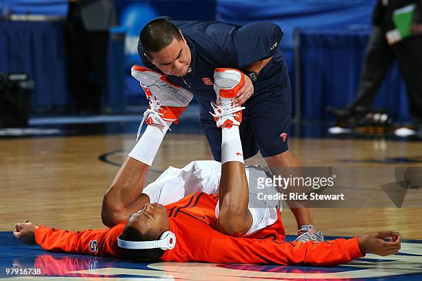 Trainer Ryan Cabiles works on Wes Johnson of the Syracuse Orange before his game against the Gonzaga Bulldogs during the second round of the 2010...