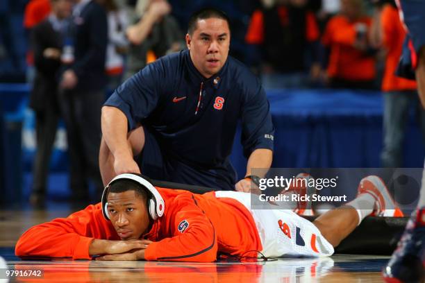 Trainer Ryan Cabiles works on Wes Johnson of the Syracuse Orange before his game against the Gonzaga Bulldogs during the second round of the 2010...